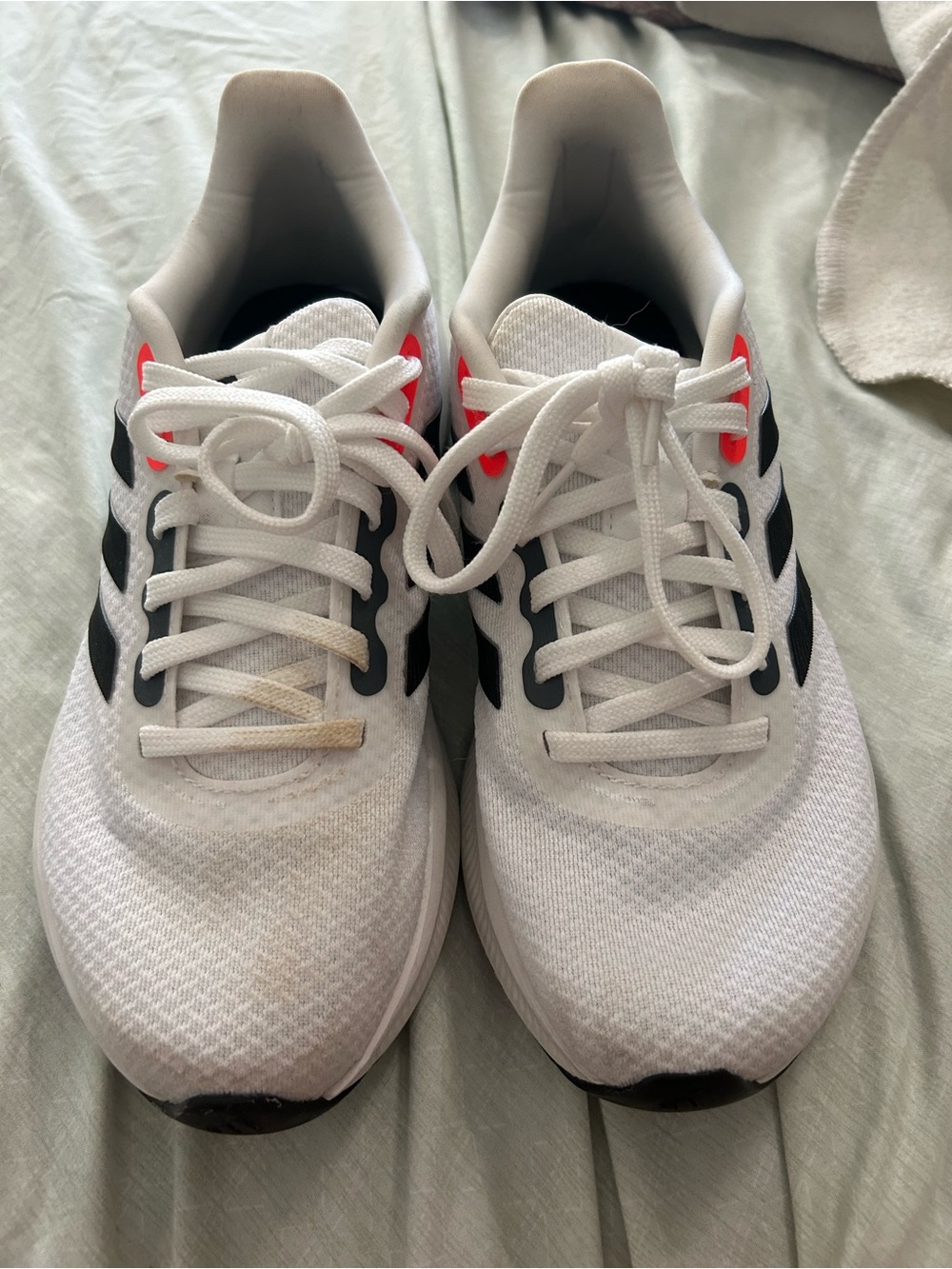 Adidas White Athletic Running Shoes with Black Accents and Pink Highlights